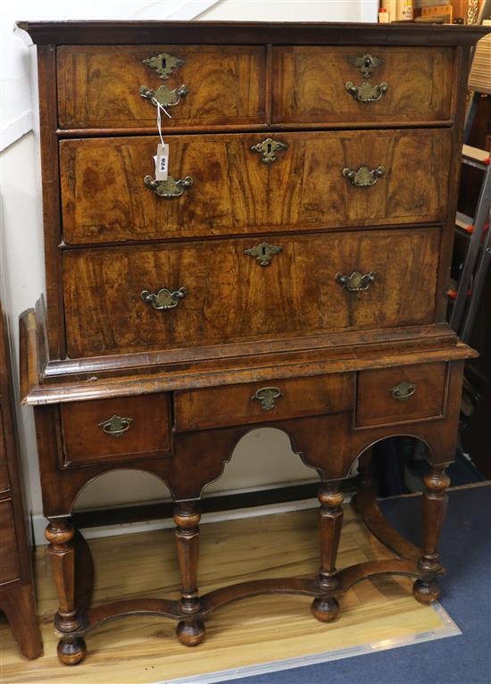 An early 18th century banded walnut chest on stand W.101cm